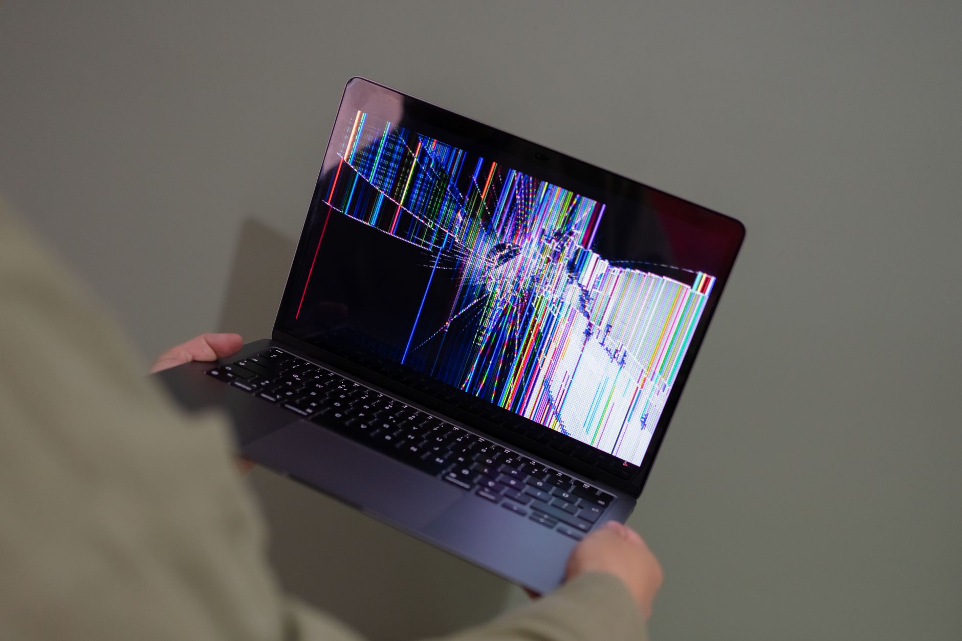 A split image compares a real human face with a digitally altered copy showing glitch artifacts.