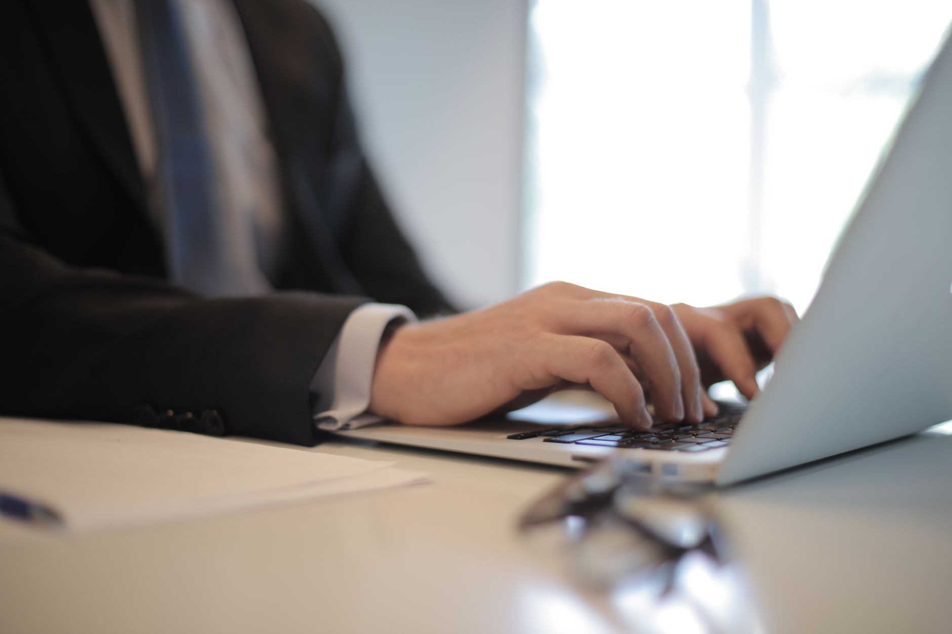 Person reading a suspicious personalized email on a laptop screen